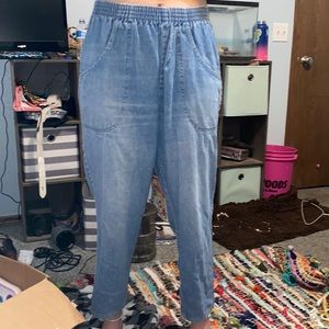 Cute boy Jean has one tear in it at the top